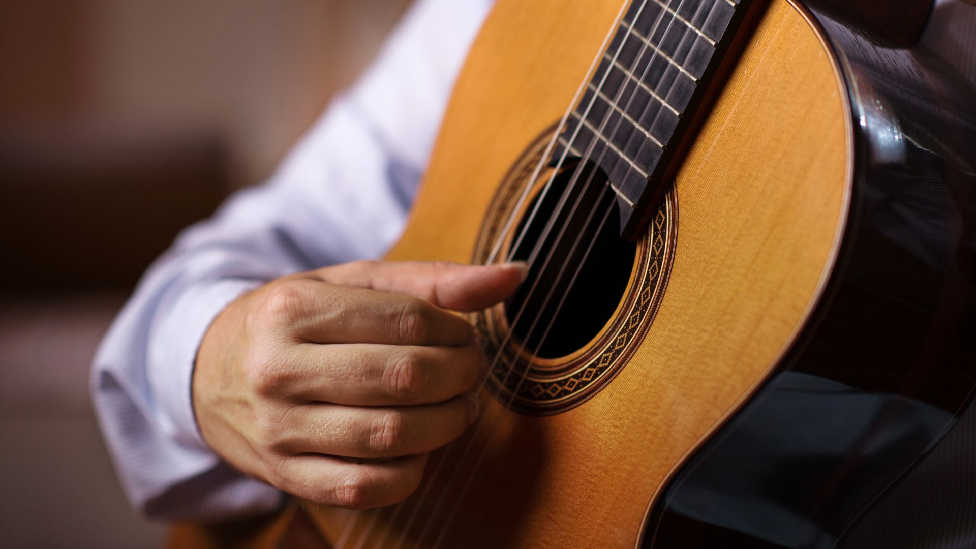 How to Play the Guitar with Long Nails?