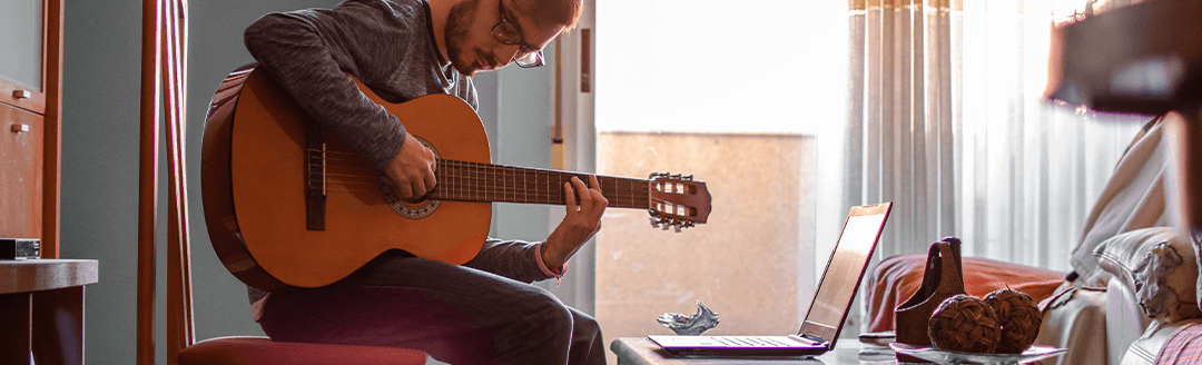 a person who learn guitar